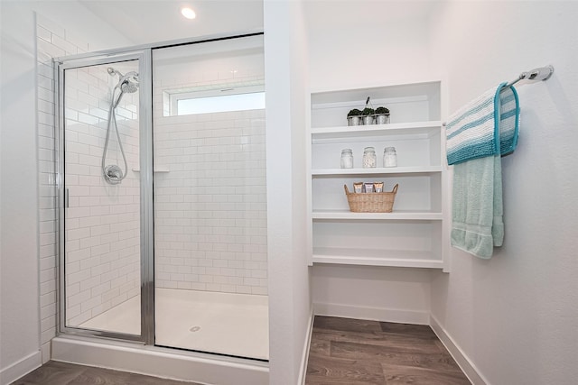 31707 Whittis Hill Way, Fulshear, TX 77441 - full bathroom featuring a shower stall, wood finished floors, and baseboards