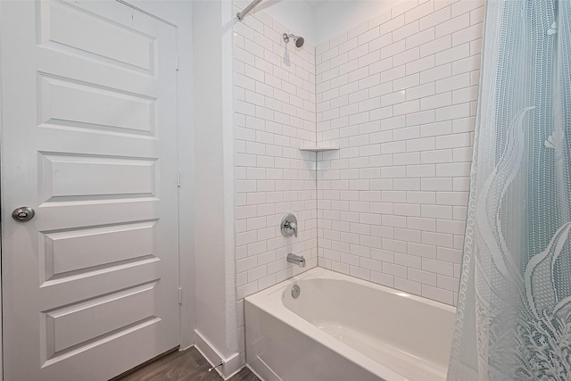 31707 Whittis Hill Way, Fulshear, TX 77441 - full bathroom featuring wood finished floors and shower / bath combo with shower curtain