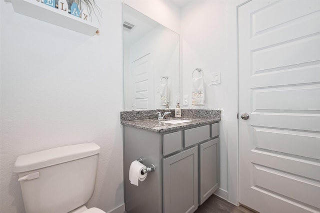 31707 Whittis Hill Way, Fulshear, TX 77441 - half bathroom with toilet, vanity, and wood finished floors