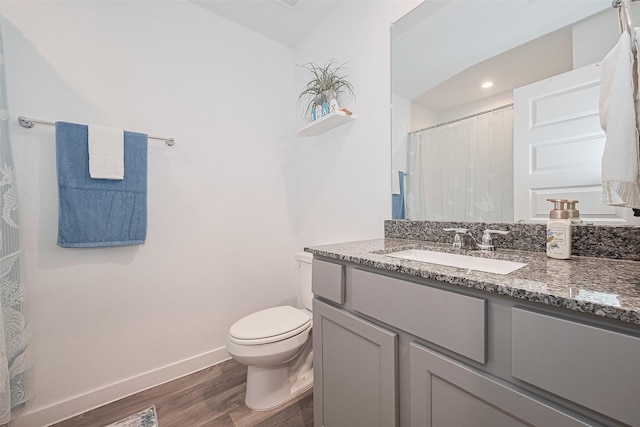 31707 Whittis Hill Way, Fulshear, TX 77441 - bathroom with wood finished floors, baseboards, toilet, and vanity