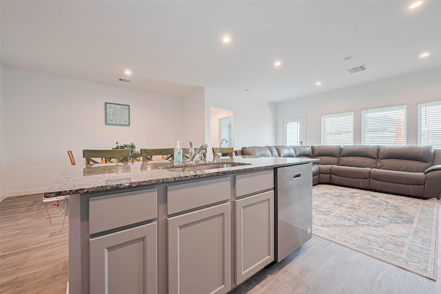 31707 Whittis Hill Way, Fulshear, TX 77441 - kitchen with a sink, dishwasher, open floor plan, light wood-style floors, and recessed lighting