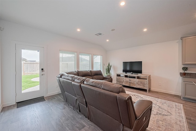 31707 Whittis Hill Way, Fulshear, TX 77441 - living area featuring wood finished floors, recessed lighting, baseboards, and vaulted ceiling