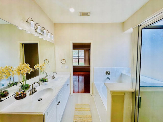 4142 Surreydon Dr, Houston, TX 77014 - full bathroom featuring a garden tub and double vanity