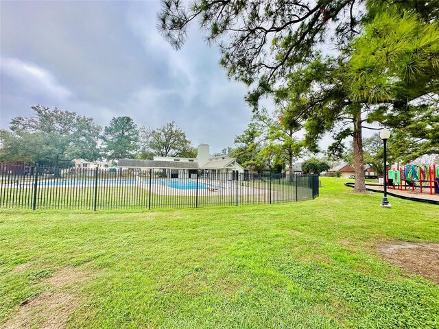 4142 Surreydon Dr, Houston, TX 77014 - view of yard featuring a community pool