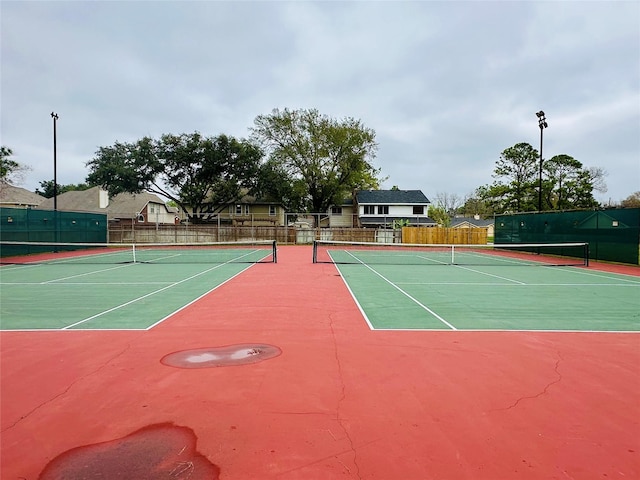 4142 Surreydon Dr, Houston, TX 77014 - view of tennis court featuring community basketball court and fence