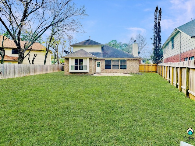 4142 Surreydon Dr, Houston, TX 77014 - back of house featuring a chimney, brick siding, and roof with shingles