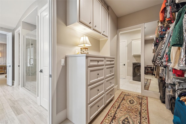 walk in closet featuring washer / dryer