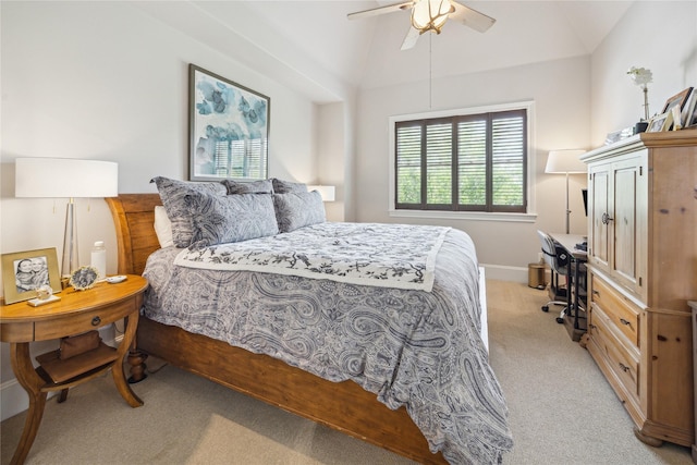 bedroom with vaulted ceiling, light colored carpet, a ceiling fan, and baseboards