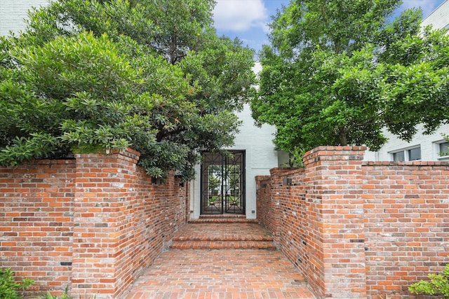 entrance to property with brick siding