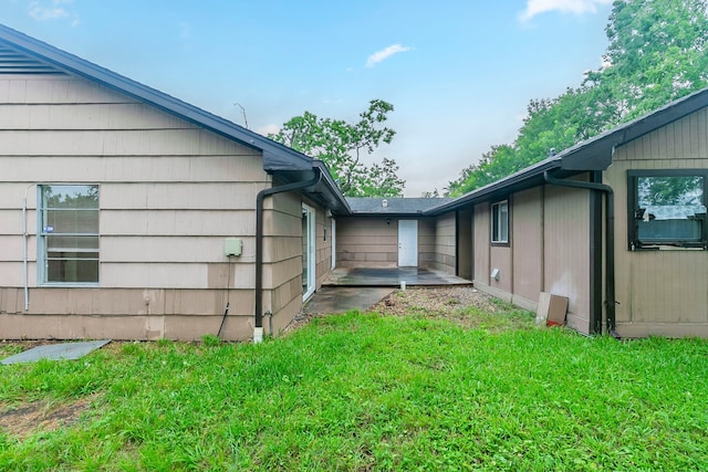 view of side of property featuring a yard