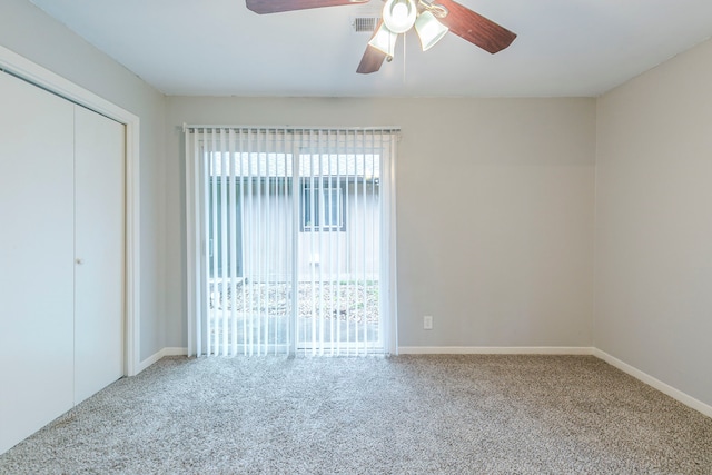 unfurnished bedroom featuring carpet floors, a closet, and baseboards