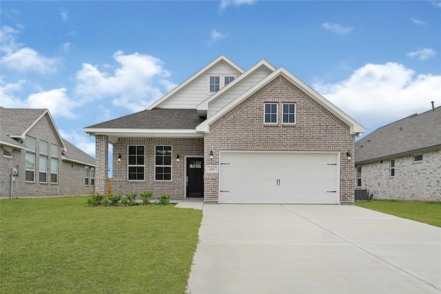 310 Little Spring Ct, Anahuac, TX 77514 - view of front of house with brick siding, concrete driveway, a front yard, and central AC