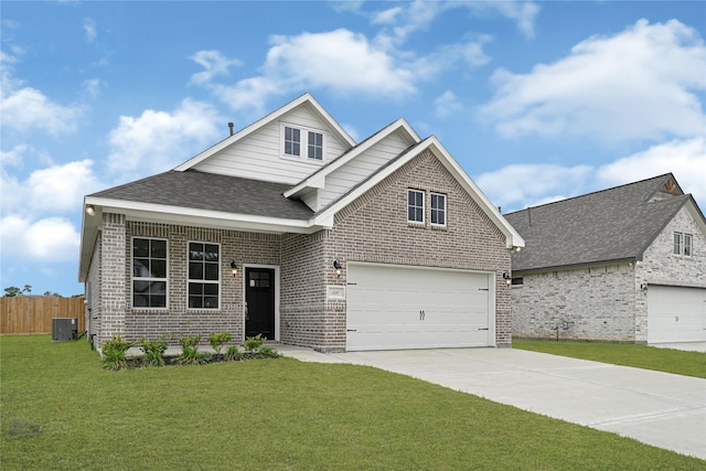 310 Little Spring Ct, Anahuac, TX 77514 - view of front facade with brick siding, cooling unit, driveway, and a shingled roof
