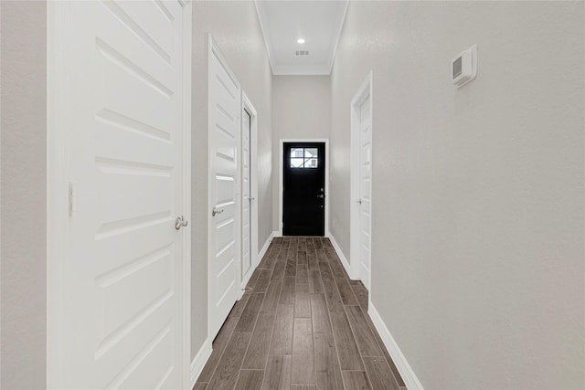 310 Little Spring Ct, Anahuac, TX 77514 - hall featuring dark wood-type flooring, baseboards, and crown molding