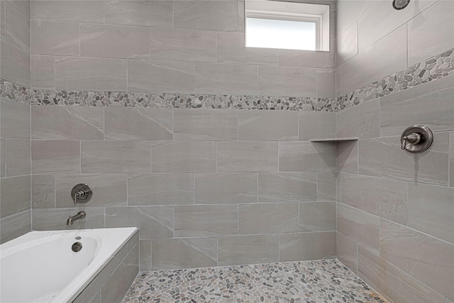 310 Little Spring Ct, Anahuac, TX 77514 - full bath featuring a tile shower and tiled tub