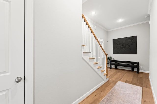 118 Reinerman St, Houston, TX 77007 - stairway featuring crown molding, wood finished floors, baseboards, and recessed lighting