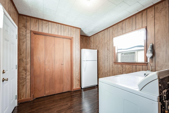 111 S Roosevelt Ave, Cleveland, TX 77327 - laundry area with washer / dryer, dark wood-type flooring, wood walls, cooling unit, and crown molding
