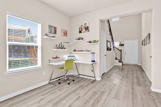 14108 Kamilia Rd, Conroe, TX 77306 - home office with light wood finished floors, plenty of natural light, and baseboards