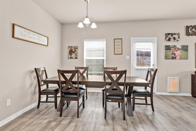 14108 Kamilia Rd, Conroe, TX 77306 - dining room featuring light wood-style floors, a chandelier, and baseboards