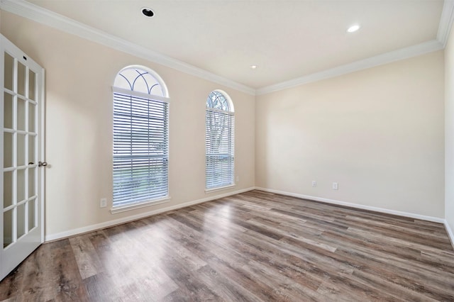 8215 Still Oak Ln, Cypress, TX 77433 - spare room featuring healthy amount of natural light, ornamental molding, wood finished floors, baseboards, and recessed lighting