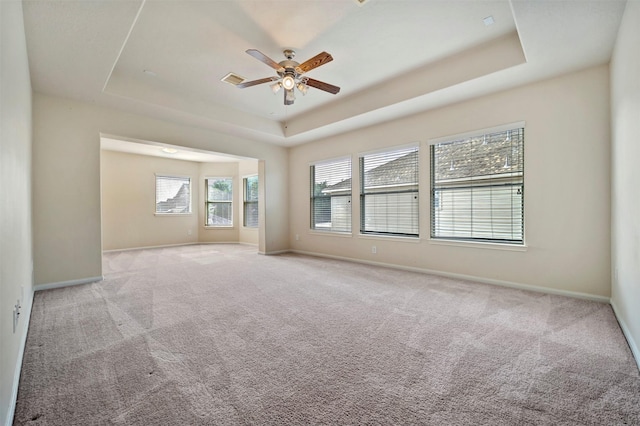 8215 Still Oak Ln, Cypress, TX 77433 - unfurnished room with a raised ceiling, light colored carpet, ceiling fan, and baseboards