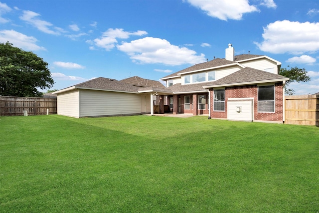 8215 Still Oak Ln, Cypress, TX 77433 - rear view of property with brick siding, a shingled roof, a chimney, and a patio