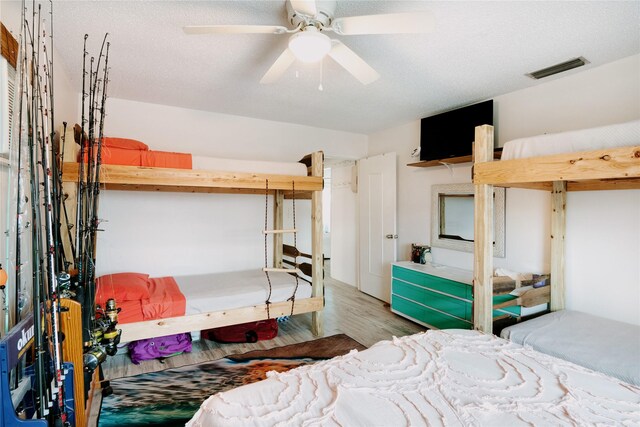 bedroom featuring wood finished floors and ceiling fan