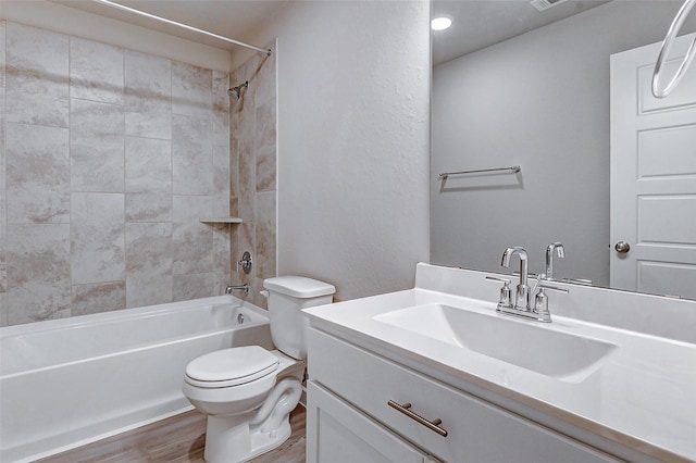 8119 Blue Fish Dr, Cypress, TX 77433 - bathroom featuring toilet, wood finished floors, bathtub / shower combination, and vanity