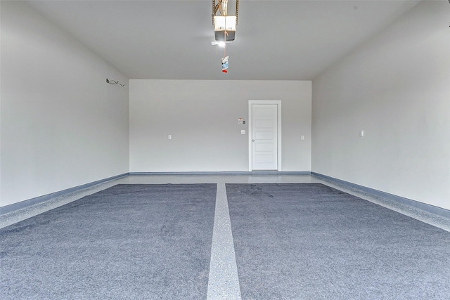 8119 Blue Fish Dr, Cypress, TX 77433 - garage featuring baseboards and a garage door opener