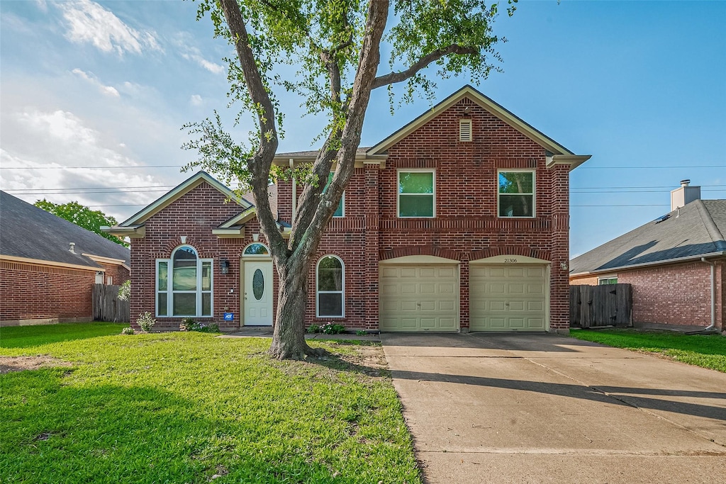 21306 Wildcroft Dr, Katy, TX 77449 - view of front facade featuring brick siding, driveway, and a garage