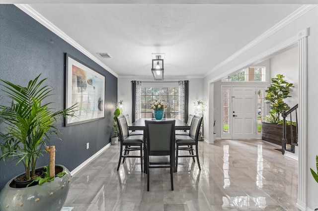 16603 April Hill St, Houston, TX 77095 - dining room featuring crown molding, a textured wall, and baseboards