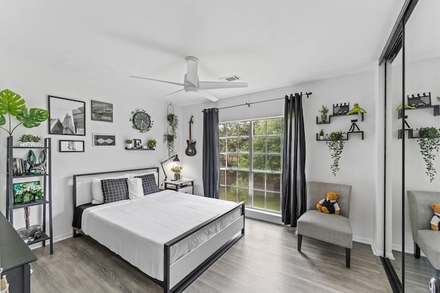 16603 April Hill St, Houston, TX 77095 - bedroom featuring wood finished floors, a ceiling fan, and baseboards