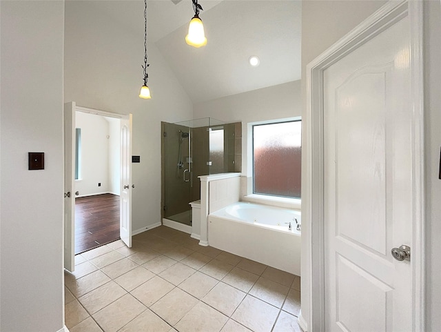 3306 Cactus Heights Ln, Pearland, TX 77581 - full bath with tile patterned flooring, a garden tub, a stall shower, high vaulted ceiling, and baseboards