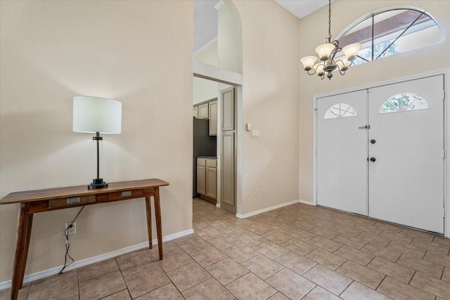 9302 Kirkchapel Ct, Spring, TX 77379 - entryway with a chandelier, a high ceiling, and baseboards