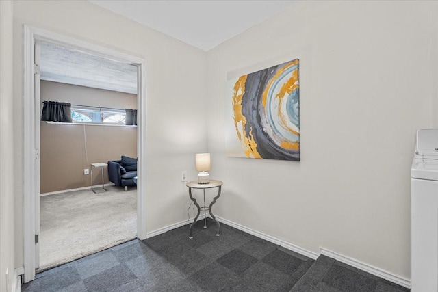 9302 Kirkchapel Ct, Spring, TX 77379 - interior space featuring washer / dryer, dark colored carpet, and baseboards
