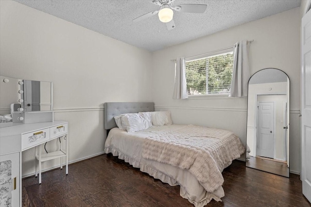 9302 Kirkchapel Ct, Spring, TX 77379 - bedroom with a textured ceiling, wood finished floors, and a ceiling fan
