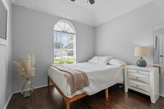 9302 Kirkchapel Ct, Spring, TX 77379 - bedroom featuring wood finished floors, baseboards, a textured ceiling, and a ceiling fan