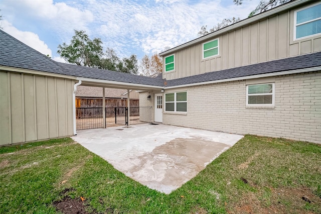 1739 Nocturne Ln, Houston, TX 77043 - rear view of property featuring board and batten siding, brick siding, and a patio area