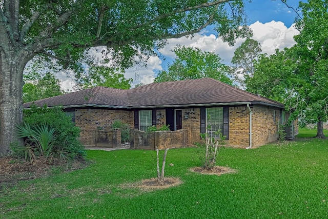 110 S Bow Dr, Lake Jackson, TX 77541 - ranch-style home featuring brick siding, a front lawn, and roof with shingles