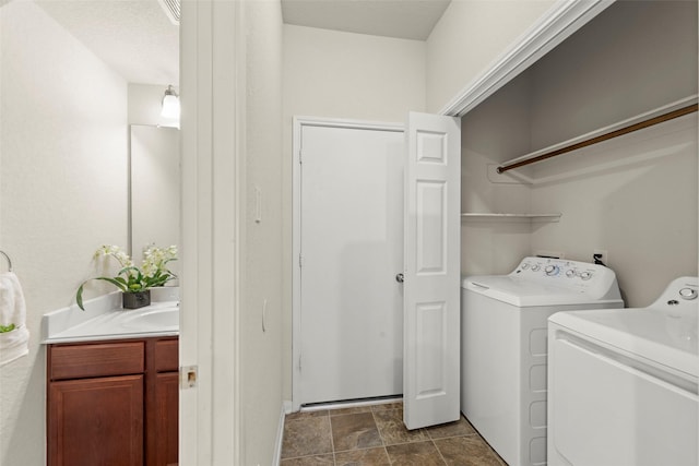 15010 Calico Heights Ln, Cypress, TX 77433 - laundry room featuring washer and clothes dryer and stone finish floors