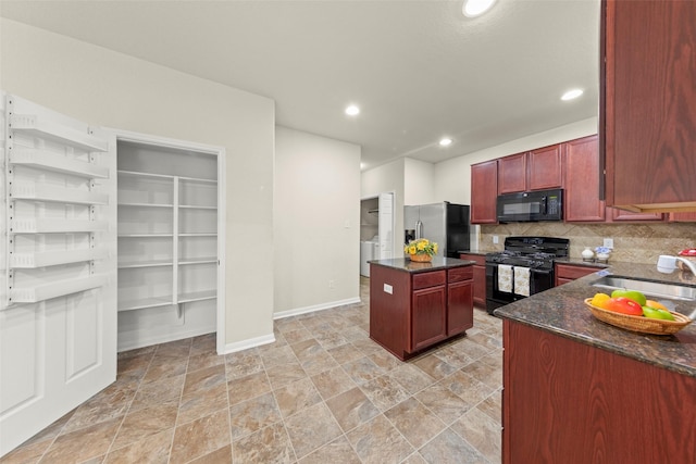 15010 Calico Heights Ln, Cypress, TX 77433 - kitchen featuring black appliances, a sink, a kitchen island, reddish brown cabinets, and decorative backsplash