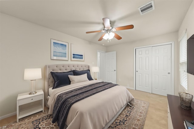 15010 Calico Heights Ln, Cypress, TX 77433 - bedroom featuring a ceiling fan, a closet, light carpet, and baseboards