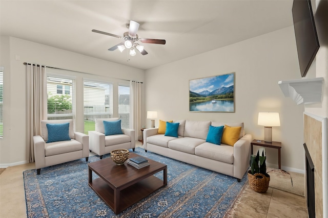 15010 Calico Heights Ln, Cypress, TX 77433 - living area featuring a fireplace, ceiling fan, and baseboards