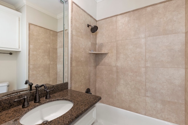 full bathroom with ornamental molding, toilet, bathing tub / shower combination, and vanity