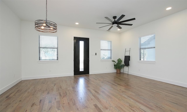 1224 Johnston St, Houston, TX 77022 - foyer featuring plenty of natural light, ceiling fan, wood finished floors, a chandelier, and recessed lighting