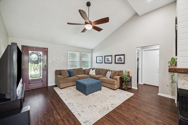 living room featuring high vaulted ceiling, a ceiling fan, dark wood finished floors, and baseboards