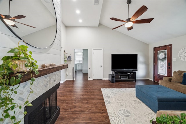 living area featuring a ceiling fan, high vaulted ceiling, dark wood-style floors, baseboards, and a multi sided fireplace