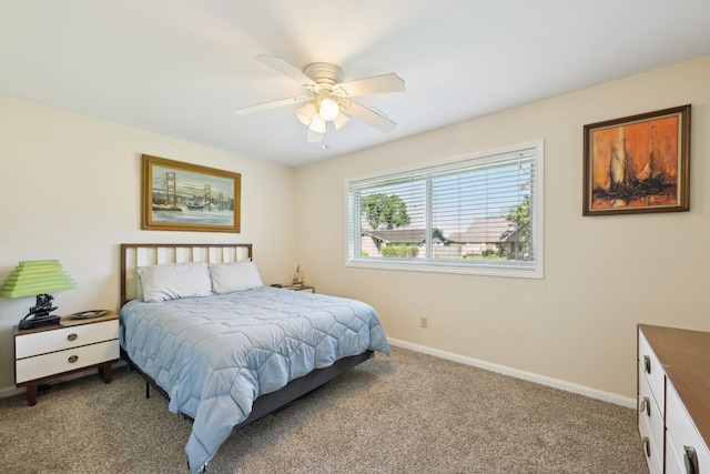 1410 Saxony Ln, Nassau Bay, TX 77058 - carpeted bedroom featuring baseboards and ceiling fan