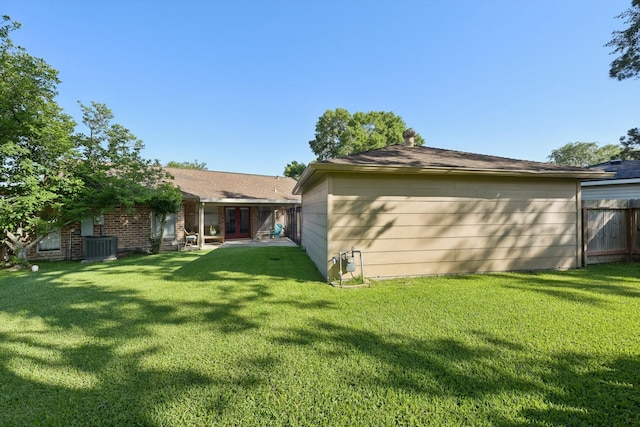 1410 Saxony Ln, Nassau Bay, TX 77058 - back of house featuring french doors and central air condition unit