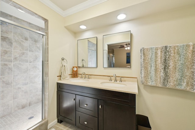 1410 Saxony Ln, Nassau Bay, TX 77058 - bathroom with ornamental molding, a shower stall, double vanity, and recessed lighting
